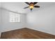 Simple bedroom featuring hardwood floors, a ceiling fan, and a window at 1421 Peachtree Ne St # 310, Atlanta, GA 30309