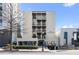 Modern condo building exterior with clean lines and black awnings in an urban setting at 1421 Peachtree Ne St # 310, Atlanta, GA 30309