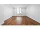 Bright, spacious living room featuring hardwood floors and a large window at 1421 Peachtree Ne St # 310, Atlanta, GA 30309