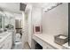 Bright bathroom featuring a vanity area, white cabinets, and views of the city at 145 15Th Ne St # 1430, Atlanta, GA 30309