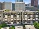 View of building surrounded by trees and cityscape at 145 15Th Ne St # 1430, Atlanta, GA 30309