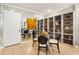 Dining area with glass table, built-in shelving, and mirrored wall at 145 15Th Ne St # 1430, Atlanta, GA 30309