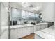 Modern kitchen with white cabinets, marble countertops, and stainless steel appliances at 145 15Th Ne St # 1430, Atlanta, GA 30309