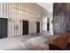 Lobby with textured wall panels, geometric wall decor, modern light fixture, and elevator access at 145 15Th Ne St # 1430, Atlanta, GA 30309