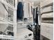 A closet including shelving, drawers and a modern washing machine at 145 15Th Ne St # 1430, Atlanta, GA 30309