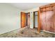 Bedroom featuring carpet and an open view of the closet and doorway at 1523 Delia Dr, Decatur, GA 30033