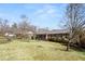 Modest brick residence with green lawn and driveway, showcasing traditional suburban living at 1523 Delia Dr, Decatur, GA 30033