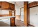 Image showcasing the kitchen's layout with a view of the dishwasher, countertops, and an open doorway at 1523 Delia Dr, Decatur, GA 30033