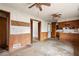 A kitchen with a dining area, vintage lighting and cabinetry, and dated flooring at 1523 Delia Dr, Decatur, GA 30033