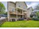 Lovely backyard view of home featuring a charming deck and a well-maintained lawn and landscaping at 1624 Duncan Nw Dr, Atlanta, GA 30318