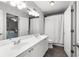 Shared bathroom featuring double sinks and lots of storage space at 1624 Duncan Nw Dr, Atlanta, GA 30318