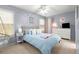 Well-lit bedroom with a ceiling fan, calming blue walls, and ample natural light at 1624 Duncan Nw Dr, Atlanta, GA 30318