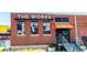 Exterior of The Works, a brick building with modern signage, steps, and a covered entrance at 1624 Duncan Nw Dr, Atlanta, GA 30318