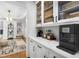 Bright butler's pantry features white cabinets, quartz countertops, and modern appliances, perfect for entertaining at 1624 Duncan Nw Dr, Atlanta, GA 30318