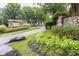 Community entrance with stone accents and colorful landscaping at 1624 Duncan Nw Dr, Atlanta, GA 30318