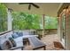 Spacious outdoor deck featuring comfortable seating, a wooded view, and natural light at 1624 Duncan Nw Dr, Atlanta, GA 30318