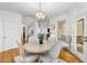 Dining room features stylish light fixture and a view into other rooms of the house at 1624 Duncan Nw Dr, Atlanta, GA 30318