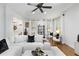 Cozy living room features an oversized white sofa, hardwood floors, and decorative shelving at 1624 Duncan Nw Dr, Atlanta, GA 30318