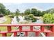 Picturesque pond featuring a charming red bridge, lush foliage, and lily pads, creating a serene natural setting at 1624 Duncan Nw Dr, Atlanta, GA 30318