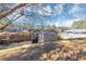 A view of the back of a house with back yard, patio, and covered grill area at 2187 Freydale Se Rd, Marietta, GA 30067