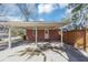 View of home's covered carport, complemented by a partial fence and open driveway at 2187 Freydale Se Rd, Marietta, GA 30067