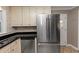 Kitchen with stainless steel refrigerator and white cabinets at 2187 Freydale Se Rd, Marietta, GA 30067