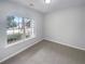 A cozy bedroom with ample natural light from a large window at 351 Beckenham Ln, Dacula, GA 30019