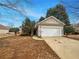 Charming one-story home featuring a two-car garage and well-maintained front yard at 351 Beckenham Ln, Dacula, GA 30019