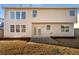 Backyard featuring a freshly planted flower bed and large glass doors at 4556 Creekside Cv, Atlanta, GA 30349