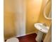 Small, yet functional powder room featuring a pedestal sink and mirror at 4556 Creekside Cv, Atlanta, GA 30349