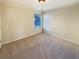 Neutral bedroom with carpeted floors and a window at 4556 Creekside Cv, Atlanta, GA 30349