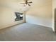 Spacious bedroom with neutral carpeting and a large window at 4556 Creekside Cv, Atlanta, GA 30349