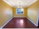 Dining room featuring hardwood floors, a chandelier, and ample natural light at 4556 Creekside Cv, Atlanta, GA 30349