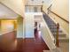 Spacious foyer featuring hardwood floors, staircase and an upstairs landing with wrought iron railing at 4556 Creekside Cv, Atlanta, GA 30349