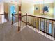 Upstairs hallway with wrought iron bannister at 4556 Creekside Cv, Atlanta, GA 30349