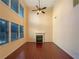 Bright living room with a fireplace, hardwood floors, and large windows at 4556 Creekside Cv, Atlanta, GA 30349