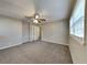 Spacious bedroom with neutral walls, carpet flooring, a ceiling fan and plenty of natural light from a large window at 1848 Englewood Way, Snellville, GA 30078