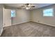 Spacious bedroom with plush carpeting, neutral paint, and a ceiling fan at 1848 Englewood Way, Snellville, GA 30078