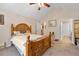 A well-lit bedroom with a wooden bed frame and access to other rooms at 302 Silver Summit Se Dr, Conyers, GA 30094