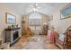 Cozy bonus room featuring an electric fireplace, vaulted ceiling, and large window that offer natural light at 302 Silver Summit Se Dr, Conyers, GA 30094