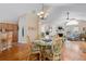 Bright dining area with glass table, decorative chairs, and hardwood floors, perfect for Gathering meals and entertaining guests at 302 Silver Summit Se Dr, Conyers, GA 30094