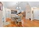 Dining area with hardwood floors, and a view of the kitchen in the background at 302 Silver Summit Se Dr, Conyers, GA 30094