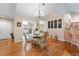 Inviting dining area with hardwood floors that leads into the living room and sunroom at 302 Silver Summit Se Dr, Conyers, GA 30094