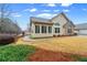 A view of the building's side, with a lovely yard, and a glimpse of the fountain pond at 302 Silver Summit Se Dr, Conyers, GA 30094