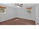 Cozy bedroom with hardwood floors and natural light from two windows at 4138 Hickory Dr, Powder Springs, GA 30127