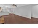 Open concept living room with hardwood floors connecting the kitchen and dining area at 4138 Hickory Dr, Powder Springs, GA 30127