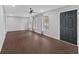 Bright living room with dark wood-look floors, neutral walls, and many windows at 4138 Hickory Dr, Powder Springs, GA 30127