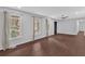 Inviting living room with wood-look floors, white trim, natural light, and a ceiling fan at 4138 Hickory Dr, Powder Springs, GA 30127