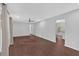 Spacious living room featuring wood-look floors, neutral walls, and a ceiling fan at 4138 Hickory Dr, Powder Springs, GA 30127