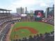 This image highlights a daytime view of a baseball field and stadium filled with fans at 4537 Moray Dr, Mableton, GA 30126